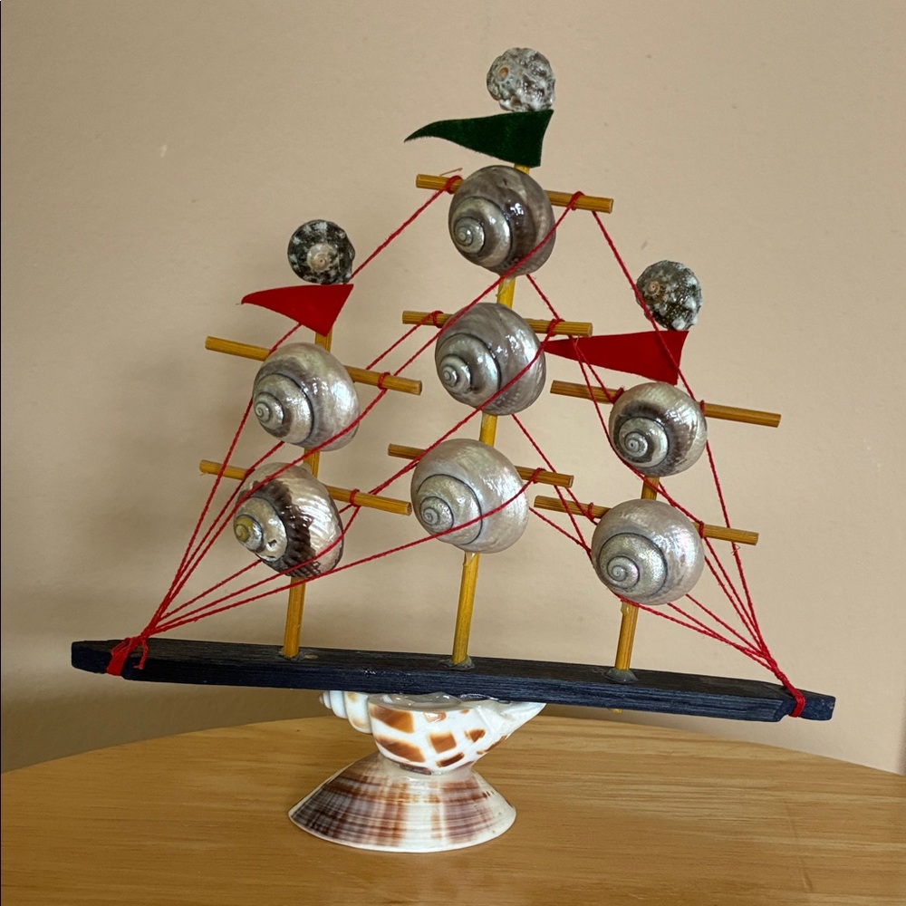 Vintage Nautical Shell Sailboat Decor with Red and Green Accents